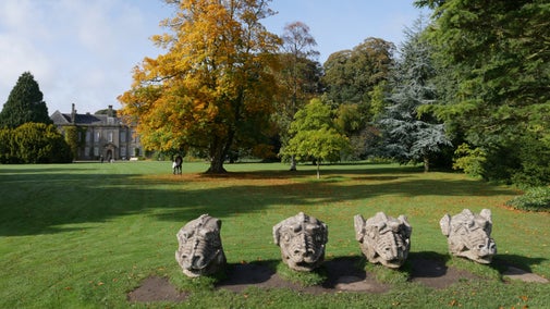 Dragon head statues on the lawn at Wallington, Northumberland,